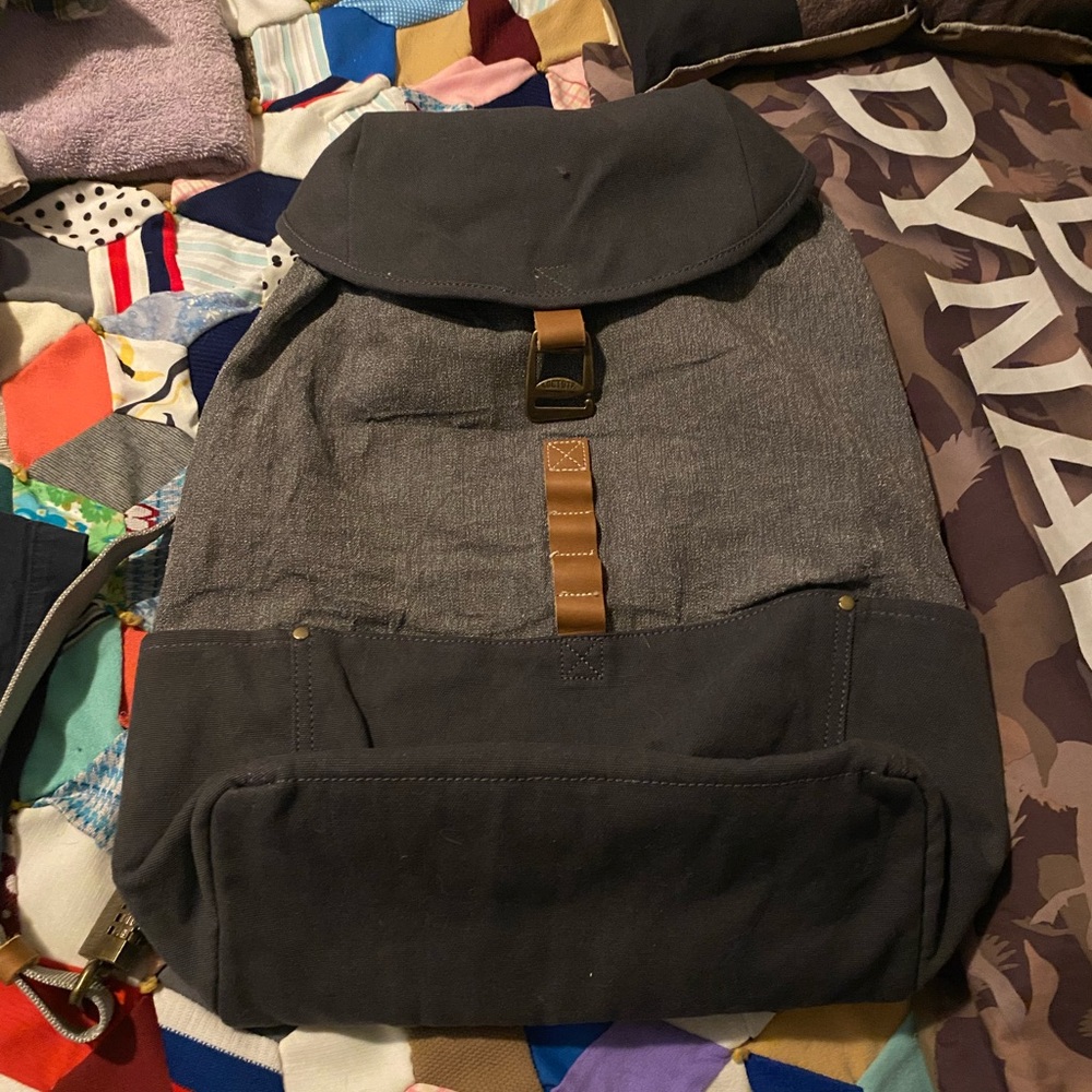 A lg loctote backpack with lock and a small crossbody